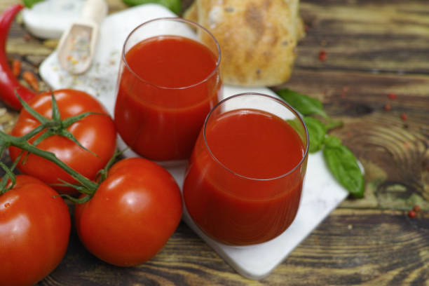 istock Raw Organic red Tomato Juice with salt, basil and bread 653439816