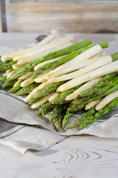 istock Spring season - fresh white and green asparagus on linen napkin 653440128