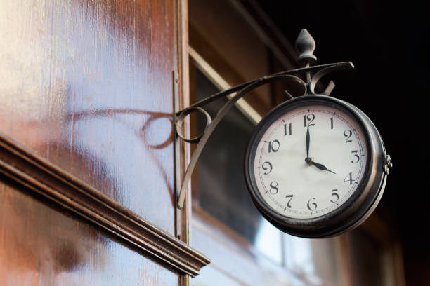 istock vintage clock on a wooden wall 653440572