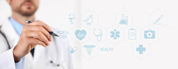 istock Doctor with a pen pointing medical icons on touchscreen 653447152
