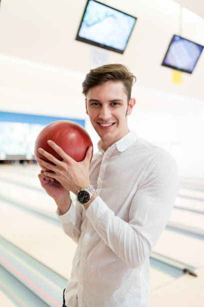 istock Handsome man with his bowling ball 653453472