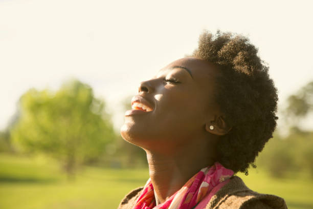 istock Woman enjoys feeling the sun on her face. 653455866