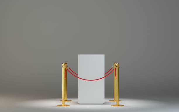 istock Empty white museum podium with barrier tape 653456342