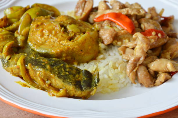 istock catfish curry and spicy stir fried chicken with basil leaf 653460462
