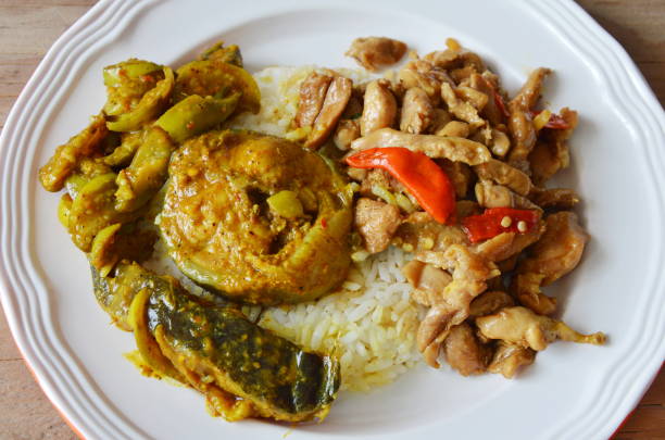 istock spicy stir fried chicken with basil leaf and catfish curry 653463856