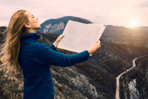 istock Traveler with map searching her way 653467188