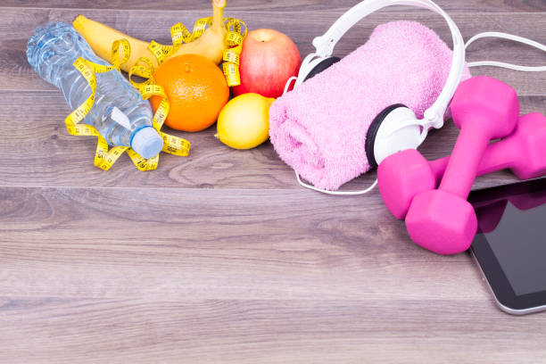 istock Fitness concept on wooden background 653468196