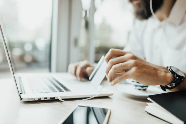istock close up of man doing purchasing online 653471694