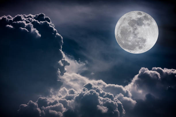 istock Nighttime sky with clouds and full moon. Vintage tone effect. 653478634