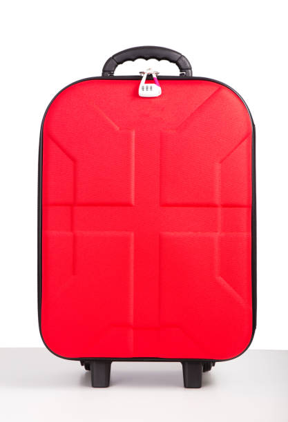 istock red luggage isolated on the white background 653478672