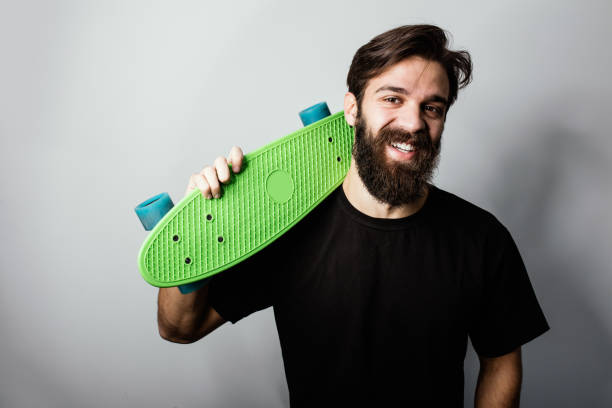 istock Portrait of smiling hipster skateboarder. Copy space 653481962