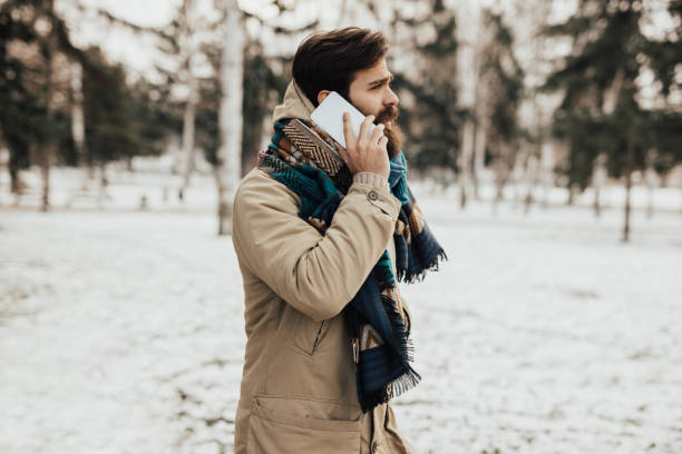 istock Cold winter day, man talking on the phone 653487532