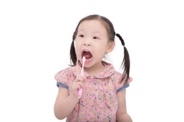 istock Little girl brushing her teeth 653490436