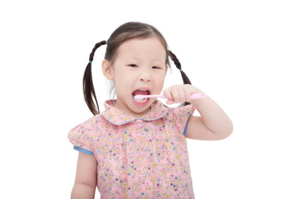istock Little girl brushing her teeth 653490448