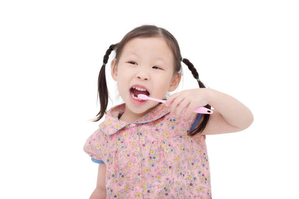 istock Little girl brushing her teeth 653490472