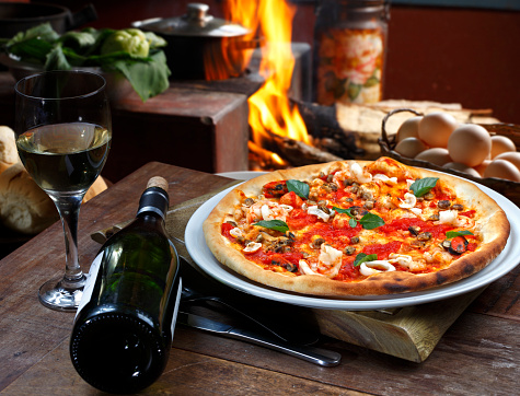 Seafood pizza with white wine