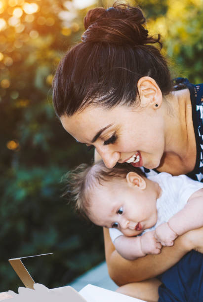 istock Happy mother carrying son 653493844
