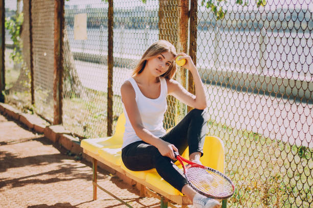 istock Girl with tennis racket 653494786