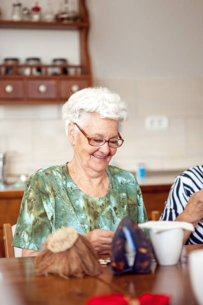 istock Smiling Senior Woman In The Community Center Doing Hand Work 653495302