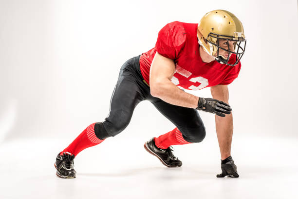 istock football player in protective sportswear 653495680