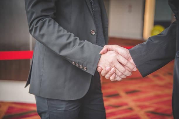 istock Shake hands in the following business situations. 653497956