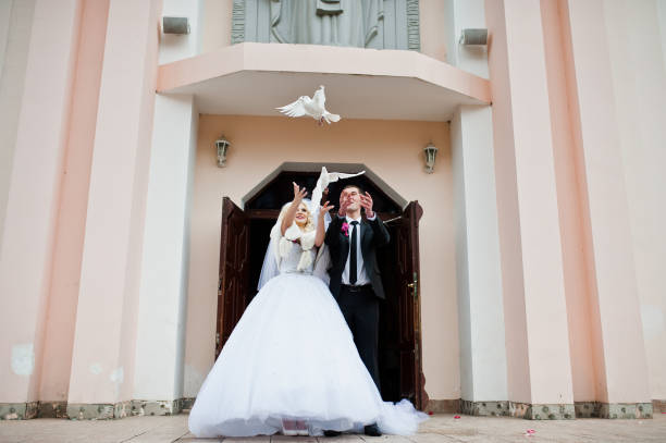 istock Wedding couple with two white pigeons 653498262