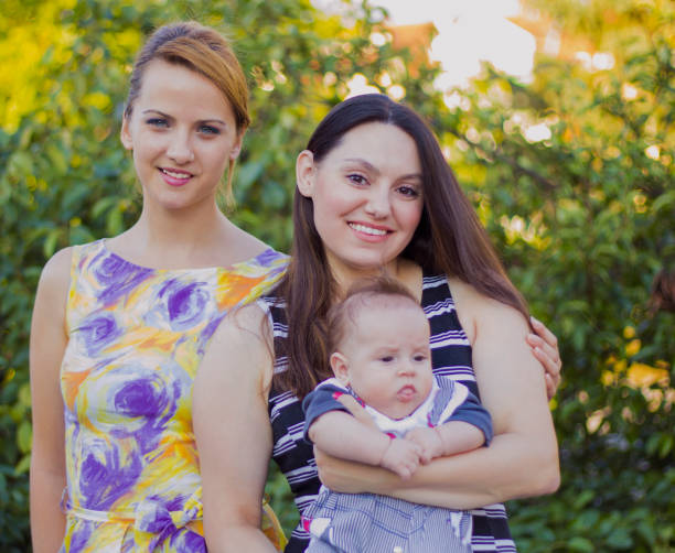 istock Mother with sister and baby 653501864