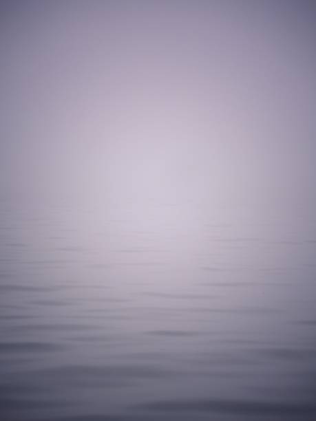 istock Sun Refraction in Sky, Cloudy Morning, Rippled Water, Copy Space 653501900