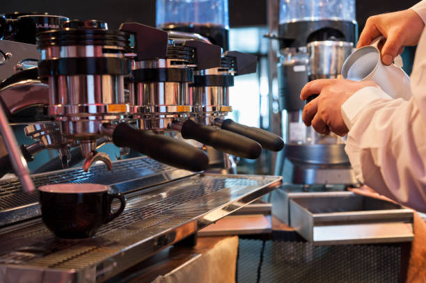 istock Preparing the coffee and cappuccino with professional espresso machine, at the bar 653502462