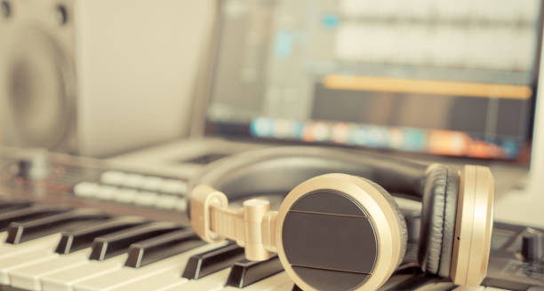 istock Golden Music Studio headphone lying on working desktop 653503816