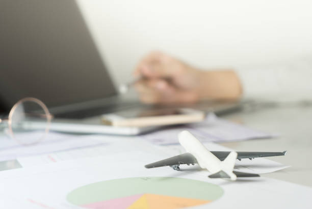istock Business man is planning his business trip on computer 653503858