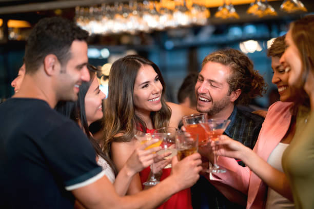 istock Group of friends at a bar making a toast 653509836