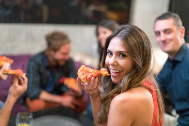 istock Woman having dinner with friends 653509840