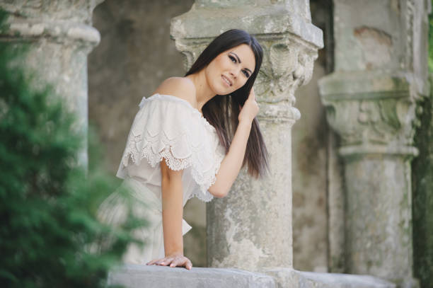 istock brunette in a dress 653510072