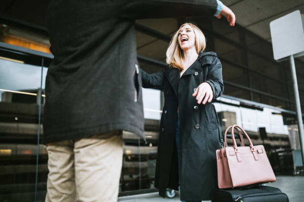 istock Couple Hug at Airport Arrival Area 653511086