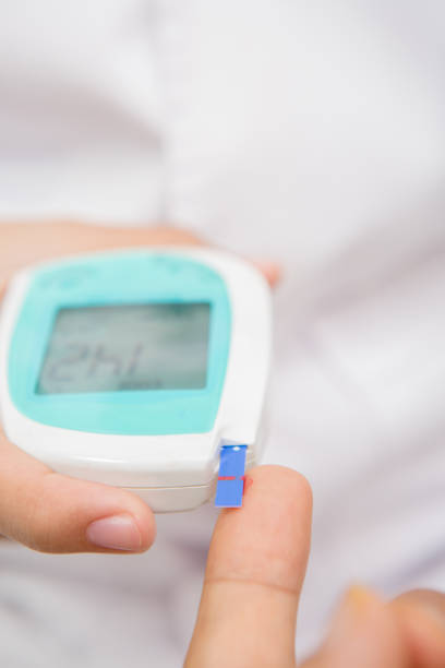 istock Close-up Of Doctor examining With Glucometer 653513306