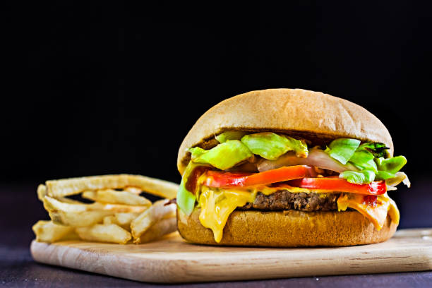 istock Cheese burger on wooden board 653513744