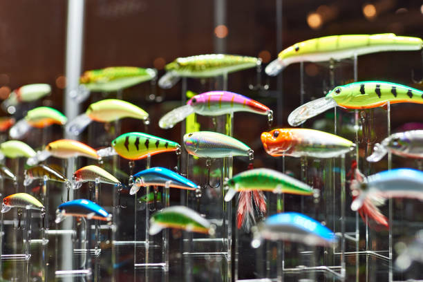 colorful plastic fishing baits in store - pescaria com iscas artificiais imagens e fotografias de stock