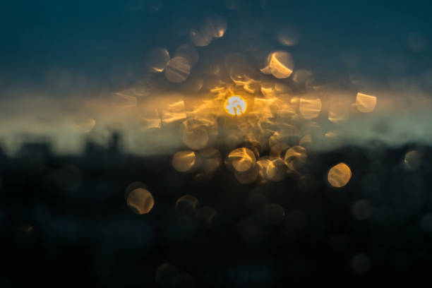Unfocuced sun and water drops on the window