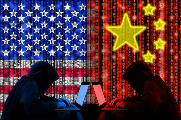 istock Amrican hacker sitting opposite of a chinese hacker cyberwar 653520950