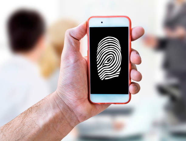istock Fingerprint and Hand holding mobile phone 653532232