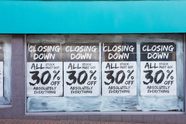 Exterior Of Shop With Closing Down Notice In Window Exterior Of Shop With Closing Down Notice In Window closing down sale stock pictures, royalty-free photos & images