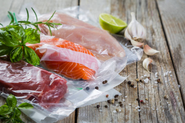 Beef, chicken and salmon in vacuum plastic bag for sous vide cooking Beef, chicken and salmon in vacuum plastic bag for sous vide cooking, copy space airtight photos stock pictures, royalty-free photos & images