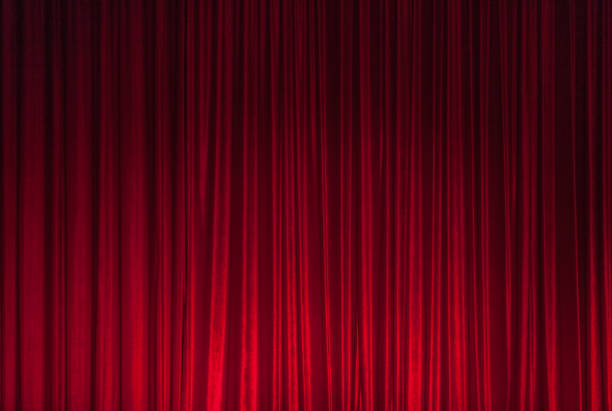 Red Theatre Stage Curtain Background Background of red spotted real theatrical velvet curtain or drapes texture awards ceremony photos stock pictures, royalty-free photos & images