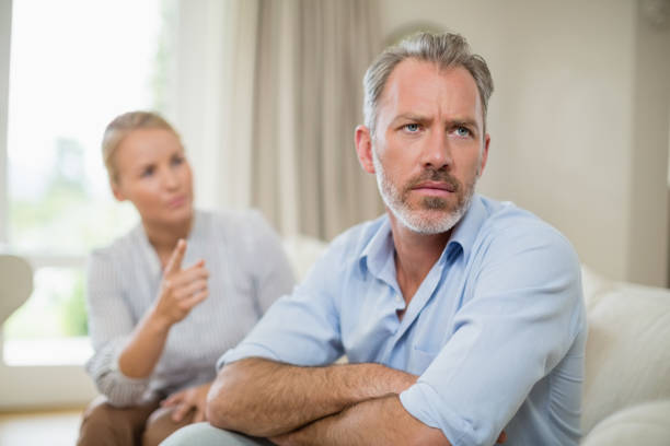 istock Couple having an argument in living room 653547838