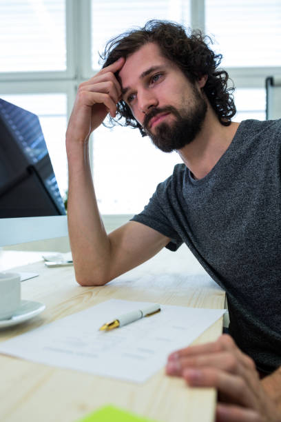 istock Stressed business executive at his desk 653622774