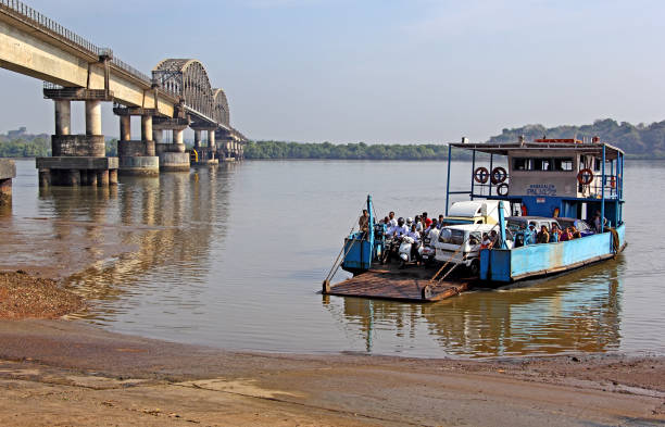 Goa: Ferry boat transfers passengers and vehicles across the Zuari River in Goa, India. Ferry boats are used where there is no bridge connectivity.
