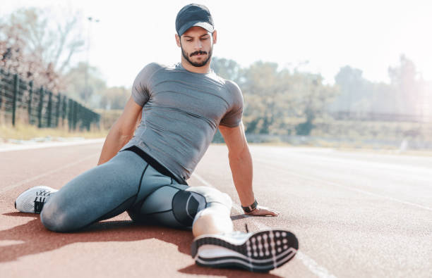 istock Runner stretching his legs after running training. Sport concept 653655084