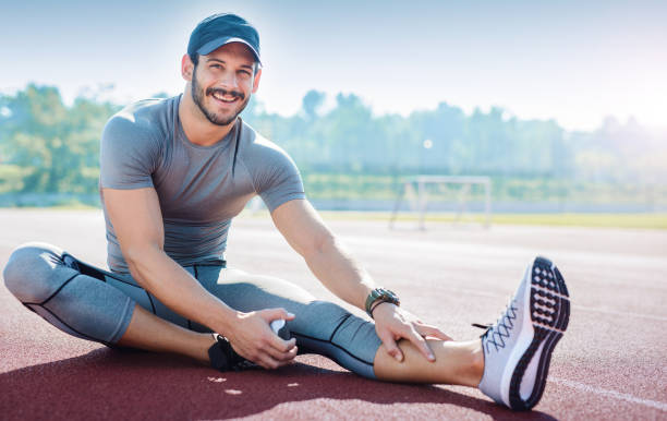istock Runner stretching his legs after running training. Sport concept 653690226