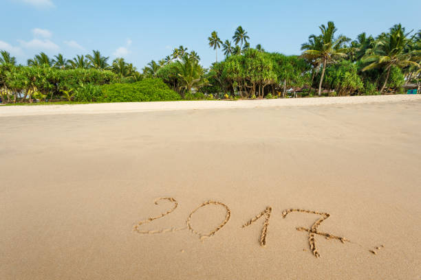 istock Happy New Year 2017 on the beach 653706642